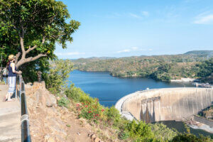 Tourist stands at the Lake Kariba Dam view point as she enjoys views of the dam wall, the water as well as the landscapes offered by the Zambian side of the Lake