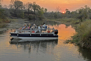 Sundowner activity on tender boat during a Kariba Cruise and Mana Pools Tour